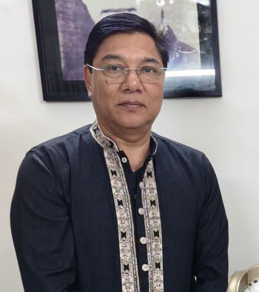 M. Rashiduzzaman Millat seated in a dark embroidered panjabi